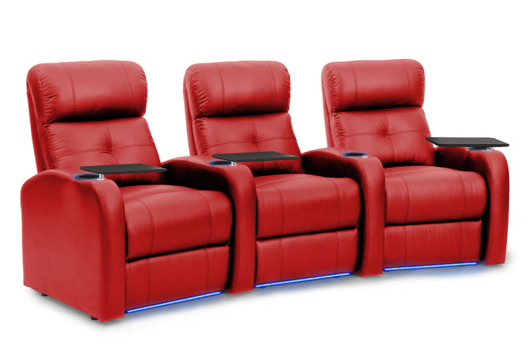 three red leather recliners with tables