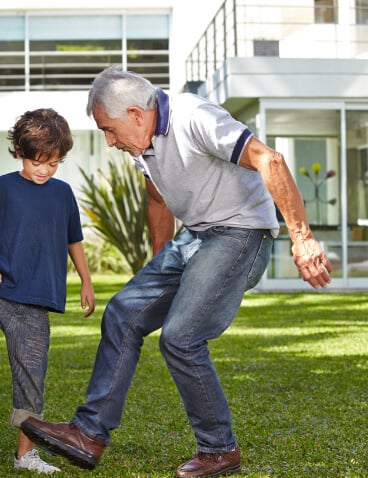 older man playing with boy