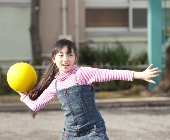 girl throwing a ball